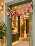 Pink floral toran with pearl and shell hangings close-up