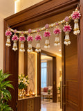 Pink flower toran hanging on door