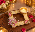 Pearl and pink stone diya holder with tea light lit